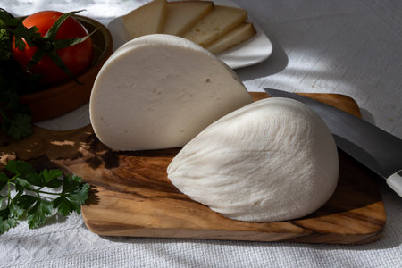 Freshly strained white soft goat cow sheep milk cheese, young Spanish cheese, close-upの写真素材