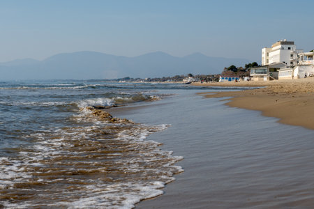 View on sandy beach and sea water in medieval small touristic coastal town Sperlonga and sea shore, Latina, Italy in winterの写真素材