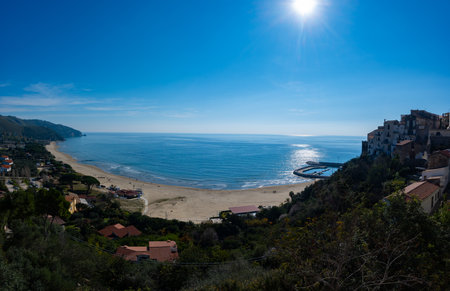 View on sandy beach from hilly medieval small touristic coastal town Sperlonga and sea shore,...