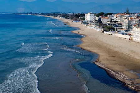 View on sandy beach from hilly medieval small touristic coastal town Sperlonga and sea shore, Latina, Italy in winterの写真素材