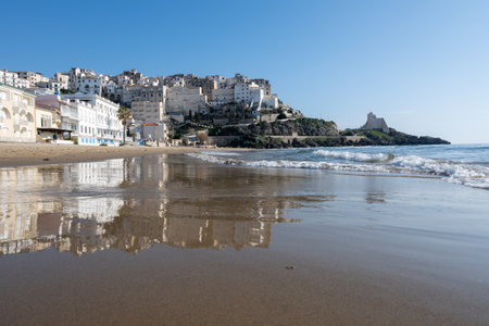 View on sandy beach and sea water in medieval small touristic coastal town Sperlonga and sea shore, Latina, Italy in winterの写真素材