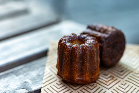 Canele, French pastry flavored with rum and vanilla, soft and tender custard center and dark,...