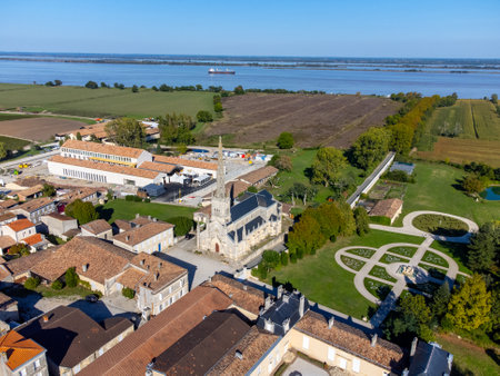 Aerial view on green vineyards, Gironde river, wine domain or chateau in Haut-Medoc red wine making region, , Bordeaux, left bank of Gironde Estuary, Franceの写真素材