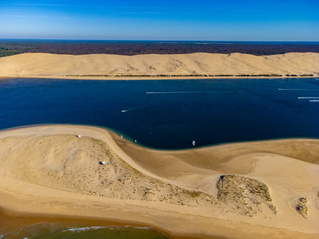 Aerial view of Dune of Pilat tallest sand dune in Europe located in La Teste-de-Buch in Arcachon Bay area, France southwest of Bordeaux along France's Atlantic coastline in sunny dayの写真素材