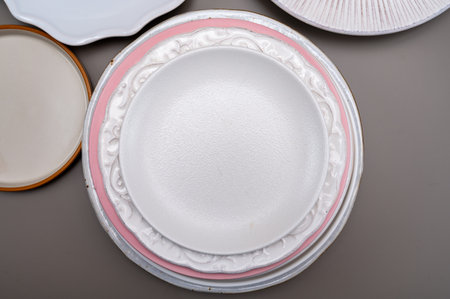 Variety of white ceramic or porcelain trendy plates flat lay copy space