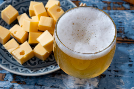 Cheese collection, Dutch ripe hard cheeses made from cow milk in the Netherlands in cubes and glass...