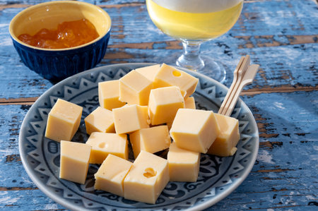 Cheese collection, Dutch ripe hard cheeses made from cow milk in the Netherlands in cubes for beerの写真素材