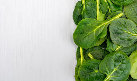 Fresh green baby Spinach leaves, diet and healthy food concept, weight loss, spinach background top view copy spaceの写真素材