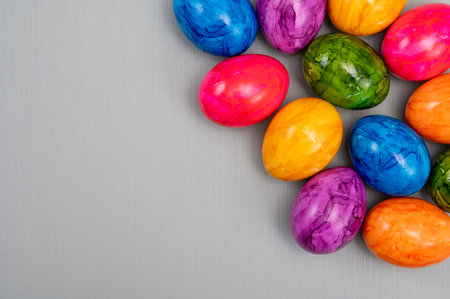 Colorful Easter eggs on table for celebration of catholic Easter in April, close up, copy space, top viewの写真素材