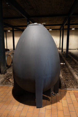 Wine celler with french concrete egg shape wine tank for aging of red wines, Haut-Medoc vineyards in Bordeaux, left bank Gironde Estuary, Pauillac, Franceの写真素材