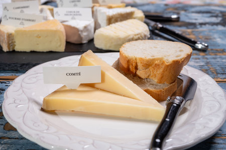 French cheese Comte, three varieties 1 year matured Prestige, fruity flavored Fruite and Vieille Reserve close upの写真素材