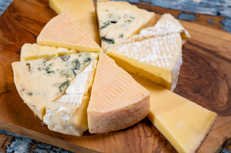 Tasting plate with many small pieces of different French cheeses, variety of cheesesの写真素材
