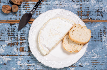 French soft Camembert cheese, original Camembert de Normandie, piece, close up with white moldの写真素材