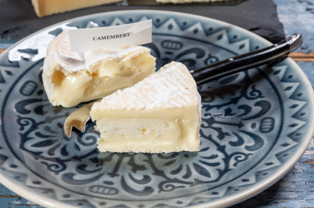 French soft Camembert cheese, original Camembert de Normandie, piece, close up with white moldの写真素材