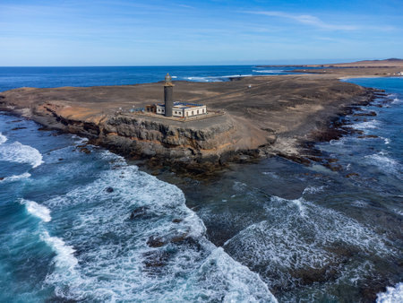 Punta de Jandia and lighthouse on southern end of Fuerteventura island, accessible only by gravel road, sunny winter dayの写真素材