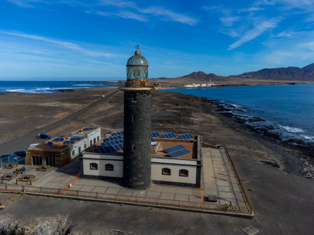 Punta de Jandia and lighthouse on southern end of Fuerteventura island, accessible only by gravel road, sunny winter dayの写真素材