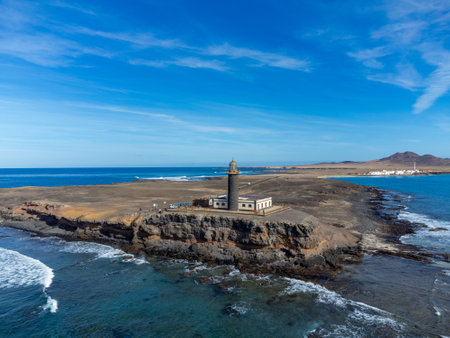 Punta de Jandia and lighthouse on southern end of Fuerteventura island, accessible only by gravel road, sunny winter dayの写真素材