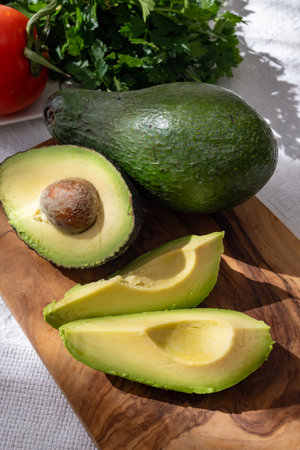 Ripe green organic avocados ready to eat, on table, Fuerteventura, Canary islands, Spainの写真素材