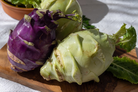 Heads of fresh ripe bio white and purple small cabbage kohlrabi from organic farm, close upの写真素材