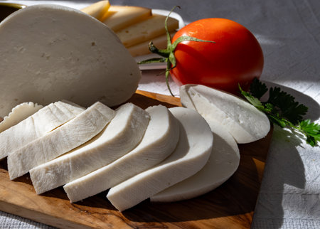 Freshly strained white soft goat cow sheep milk cheese, young Spanish cheese, close-upの写真素材