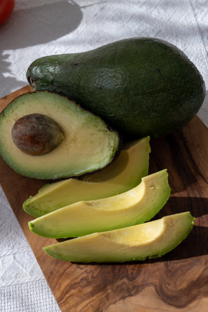 Ripe green organic avocados ready to eat, on table, Fuerteventura, Canary islands, Spainの写真素材