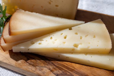 Spanish hard manchego, cow, sheep and goat cheese close upの写真素材