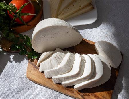 Freshly strained white soft goat cow sheep milk cheese, young Spanish cheese, close-upの写真素材