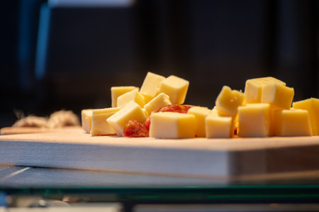 Tasting of different cheeses and sausages in Dutch cheese farm shop