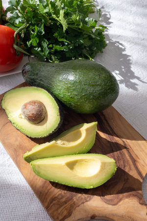 Ripe green organic avocados ready to eat, on table, Fuerteventura, Canary islands, Spainの写真素材