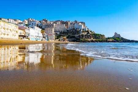 View on sandy beach and sea water in medieval small touristic coastal town Sperlonga and sea shore, Latina, Italy in winterの写真素材