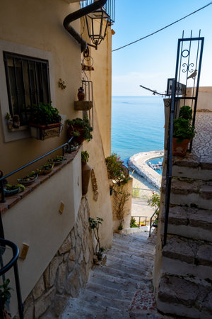 White old houses and narrow streets in medieval small touristic coastal town Sperlonga, Latina, vacation in Italy, winterの写真素材