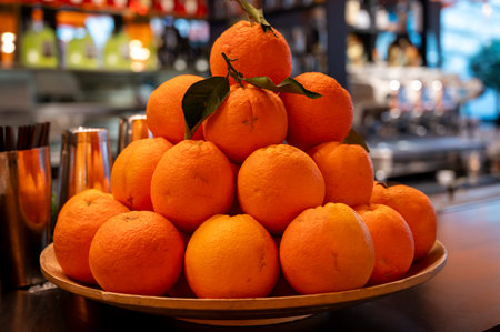 Fresh ripe sicilian oranges citrus fruits on board in cocktails bar in Milan, Italyの写真素材