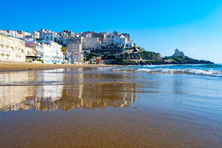 View on sandy beach and sea water in medieval small touristic coastal town Sperlonga and sea shore, Latina, Italy in winterの写真素材