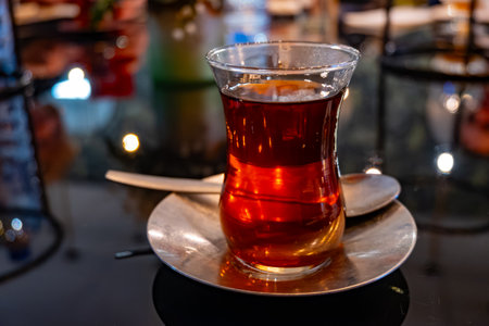 Turkish sweet tea served in traditional glass in restaurant in Istanbul, Turkey, close upの写真素材