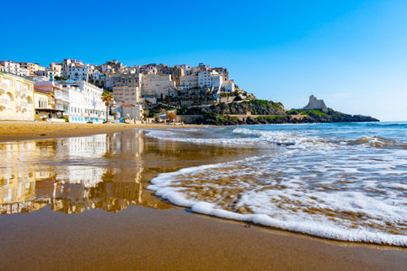 View on sandy beach and sea water in medieval small touristic coastal town Sperlonga and sea shore, Latina, Italy in winterの写真素材