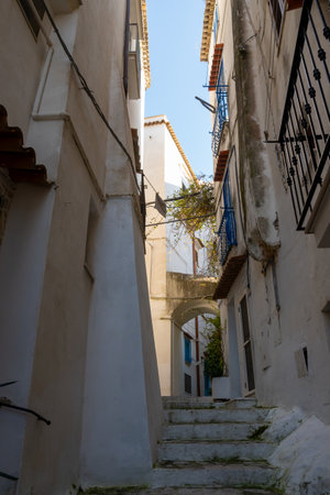 White old houses and narrow streets in medieval small touristic coastal town Sperlonga, Latina, vacation in Italy, winterの写真素材