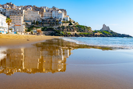 View on sandy beach and sea water in medieval small touristic coastal town Sperlonga and sea shore, Latina, Italy in winterの写真素材