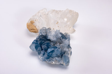 White and blue mountains crystal of colorful gemstone quarts, geology mineral background close up on white backgroundの写真素材