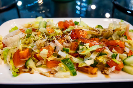 Green fresh vegetables salad for turkish mixed grill meat, chicken wings, lamb, beef shashlik, kebab in restaurantの写真素材