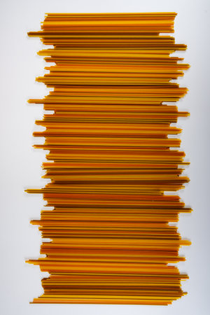 Food background, colorful dried pasta spaghetti, paralleled lines, wallpapers with stripes, restaurant wall decorationの写真素材