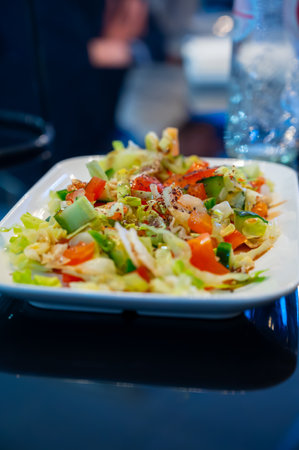 Green fresh vegetables salad for turkish mixed grill meat, chicken wings, lamb, beef shashlik, kebab in restaurantの写真素材