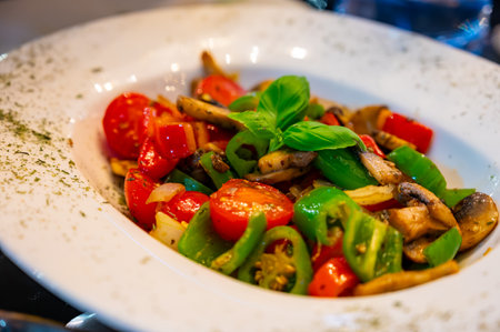 Vegetarian dishes, mezze in Turkish restaurant, grilles mushrooms, peppers and fresh vegetables saladの写真素材
