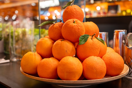 Fresh ripe sicilian oranges citrus fruits on board in cocktails bar in Milan, Italyの写真素材