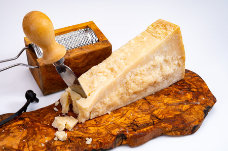 Traditional italian food - 24 months aged in caves Italian parmesan hard cheese from Parmigiano-Reggiano, Italyの写真素材