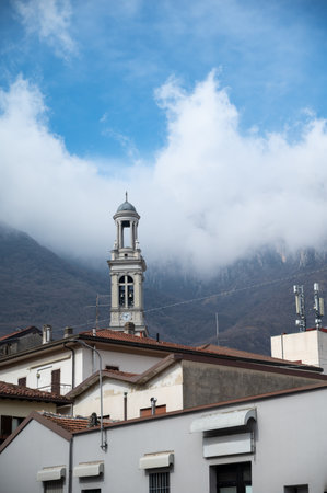 Driving car on road along shores of Lake Como in Northern Italy, spring sunny days, views of alpine mountains, water and villagesの写真素材
