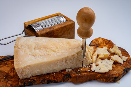 Traditional italian food - 24 months aged in caves Italian parmesan hard cheese from Parmigiano-Reggiano, Italyの写真素材