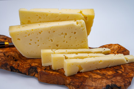 Fresh Asiago cow's milk cheese, produced in Asiago in Italy, different textures according to its aging, used in panini, sandwiches, melted on variety of dishes, classified Swiss-type Alpine cheeseの写真素材