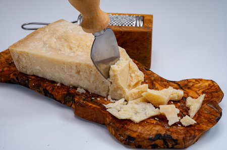 Traditional italian food - 24 months aged in caves Italian parmesan hard cheese from Parmigiano-Reggiano, Italyの写真素材
