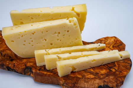 Fresh Asiago cow's milk cheese, produced in Asiago in Italy, different textures according to its aging, used in panini, sandwiches, melted on variety of dishes, classified Swiss-type Alpine cheeseの写真素材