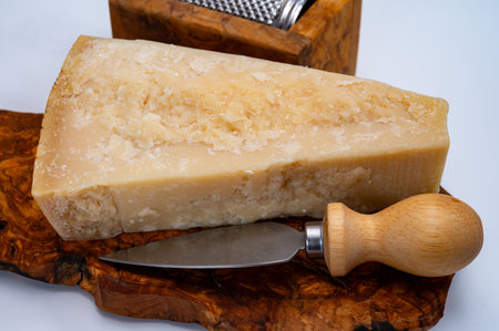 Traditional italian food - 24 months aged in caves Italian parmesan hard cheese from Parmigiano-Reggiano, Italyの写真素材